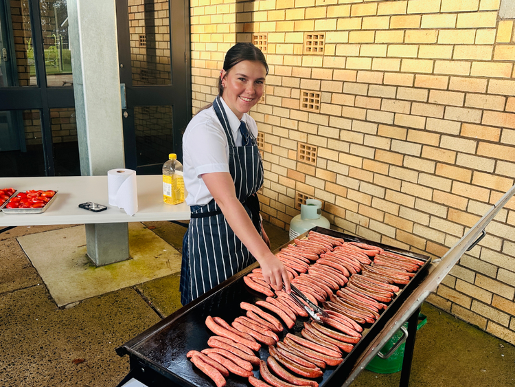 Student cooking community BBQ
