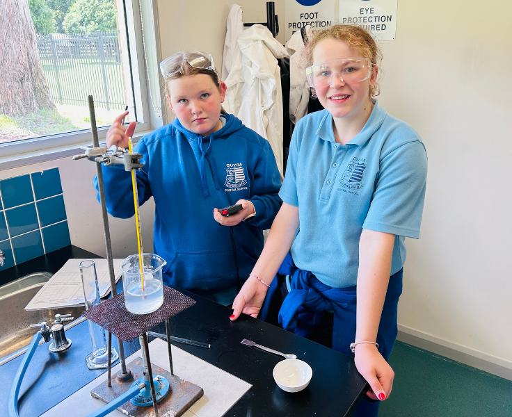 Secondary school students conducting a science experiment