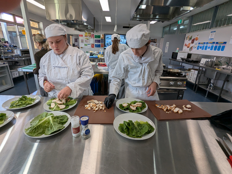 Students working in hospitality kitchen
