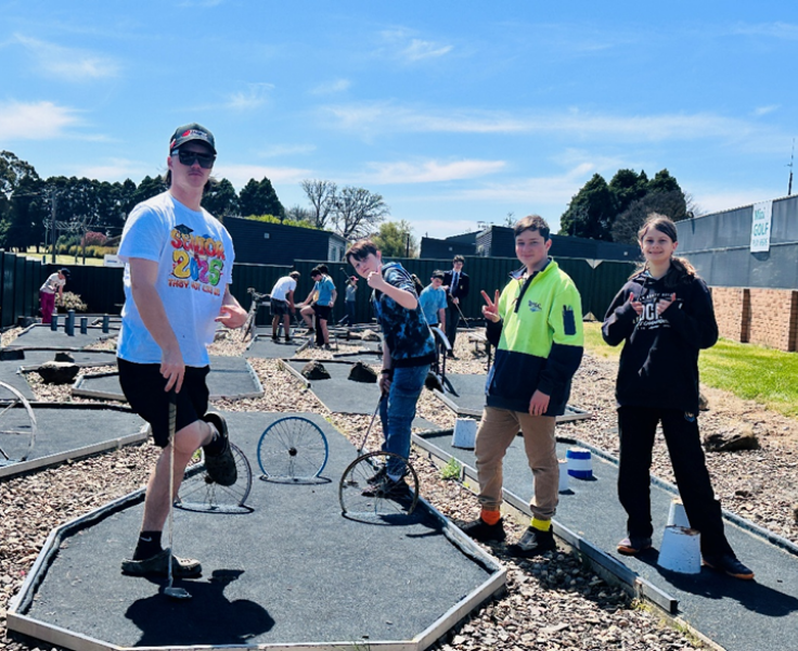 Secondary students playing put put golf during PBL rewards day