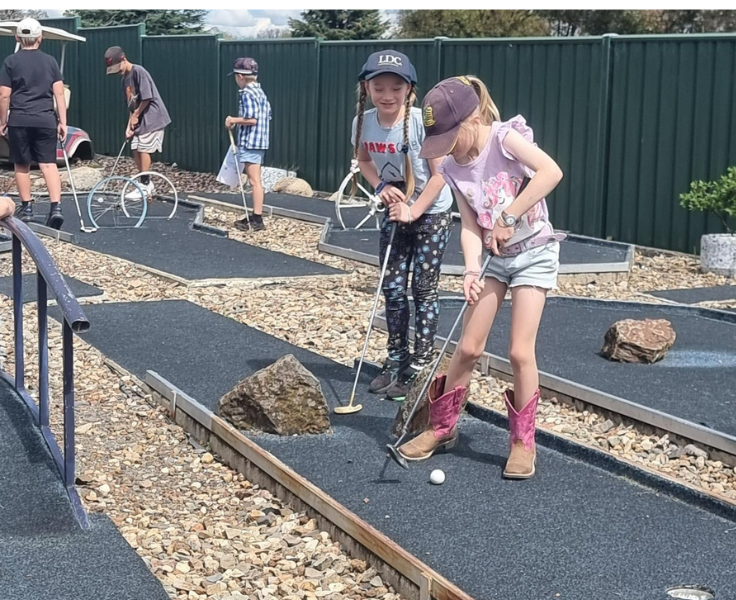 Primary students playing put put golf during PBL rewards session