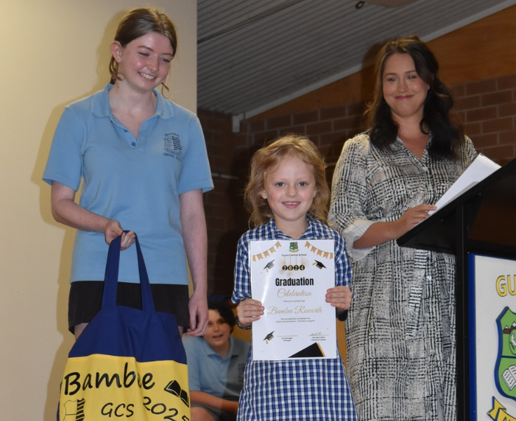 Transition program graduation assembly - presentation of certificate and library bag