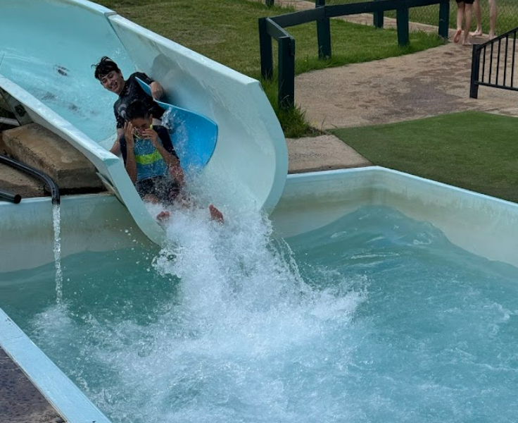 Students on water slide at Green Valley PBL rewards day
